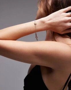 AllSaints Star Pendent Bracelet In Gold For Women Crystal